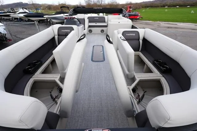 Slide: The Image of 2025 Harris 230 Cruiser boat interior with spacious seating and storage compartments. - 10