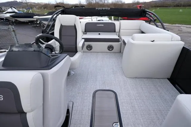 Slide: The Image of 2025 Harris 230 CRUISER boat interior with plush seating and modern design. - 11