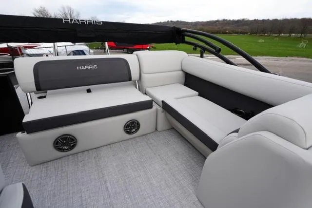 Slide: The Image of 2025 Harris 230 Cruiser boat interior with plush seating and modern design. - 12