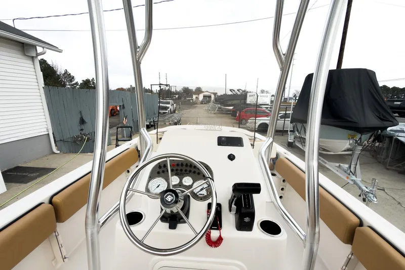 Slide: The Image of 2025 Carolina Skiff 21 Ultra Elite boat console with steering wheel and controls. - 17