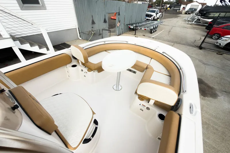 Slide: The Image of 2025 Carolina Skiff 21 Ultra Elite boat interior with seating and table. - 23