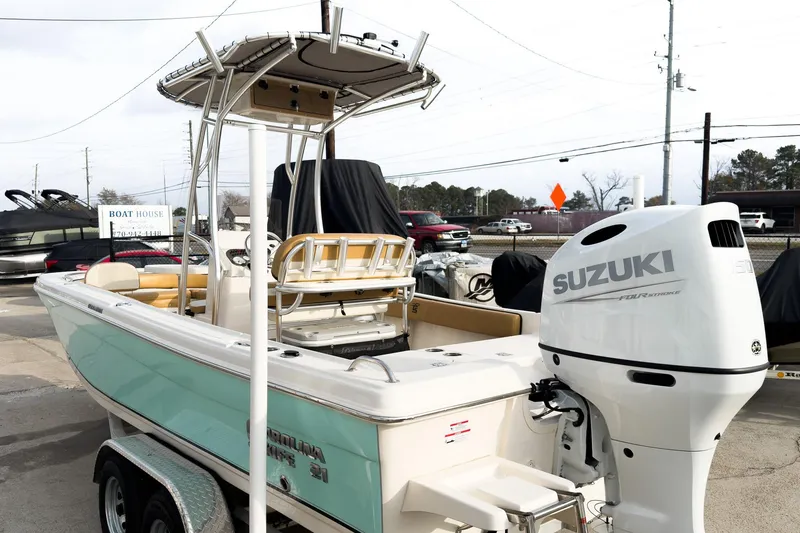 Slide: The Image of 2025 Carolina Skiff 21 Ultra Elite boat with Suzuki outboard motor on trailer. - 5
