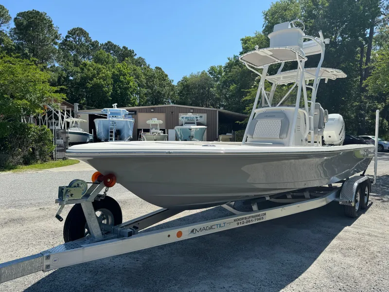 Slide: The Image of 2024 Avenger AV26 boat on trailer in outdoor setting. - 1