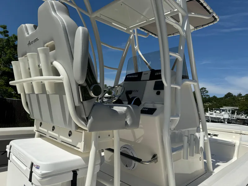 Slide: The Image of 2024 Avenger AV26 boat interior with helm, seating, and rod holders. - 10