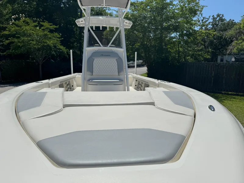 Slide: The Image of 2024 Avenger AV26 boat with cushioned seating and sleek design. - 13