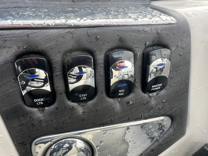 Slide: The Image of Control panel of a 2018 Starcraft 23 C boat with wet switches. - 12