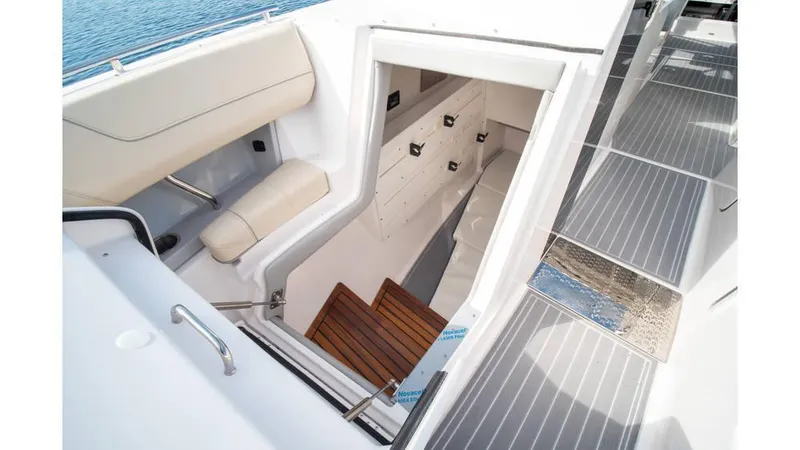 Slide: The Image of 2022 Regal LS36 boat interior with stairs and seating area. - 13