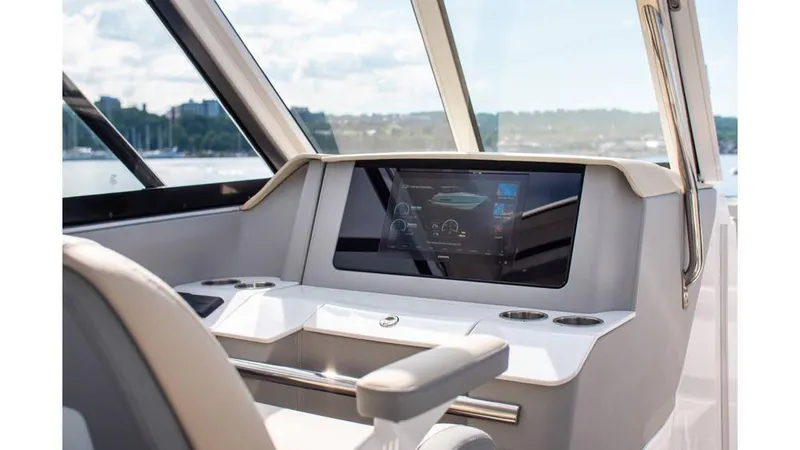 Slide: The Image of 2022 Regal LS36 helm with touchscreen display and modern controls. - 17