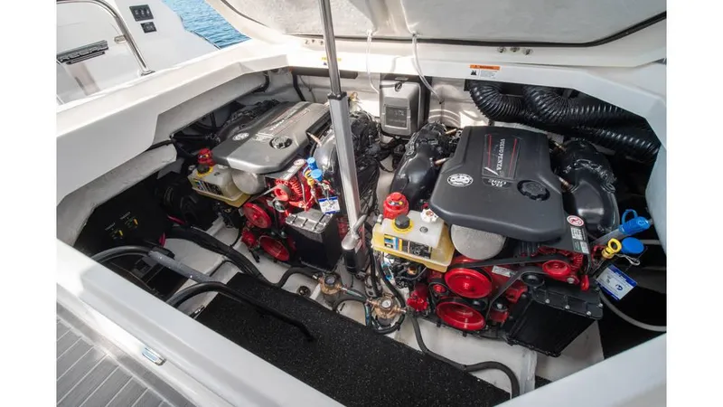 Slide: The Image of Engine compartment of 2022 Regal LS36 boat, showcasing dual engines and components. - 18