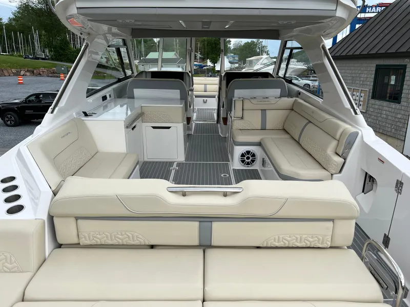 Slide: The Image of 2022 Regal LS36 boat interior with luxurious seating and modern design. - 27
