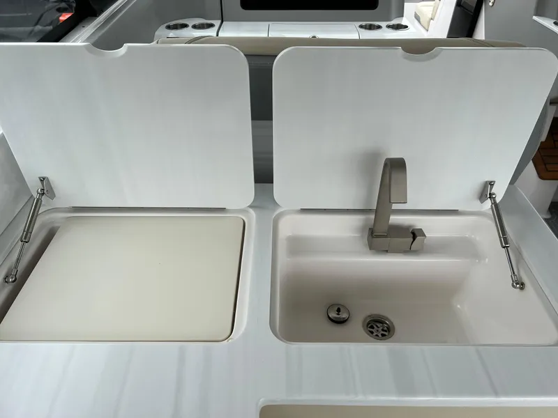 Slide: The Image of 2022 Regal LS36 boat kitchen sink and countertop with modern design. - 34