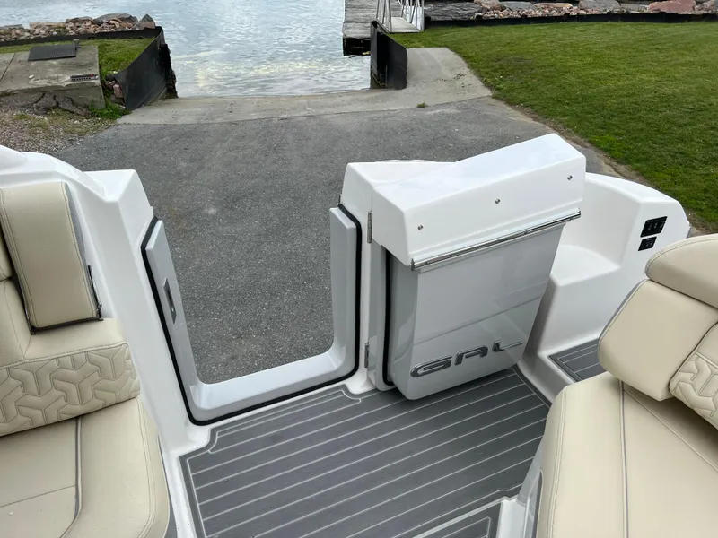 Slide: The Image of 2022 Regal LS36 boat interior with open deck view near water. - 37