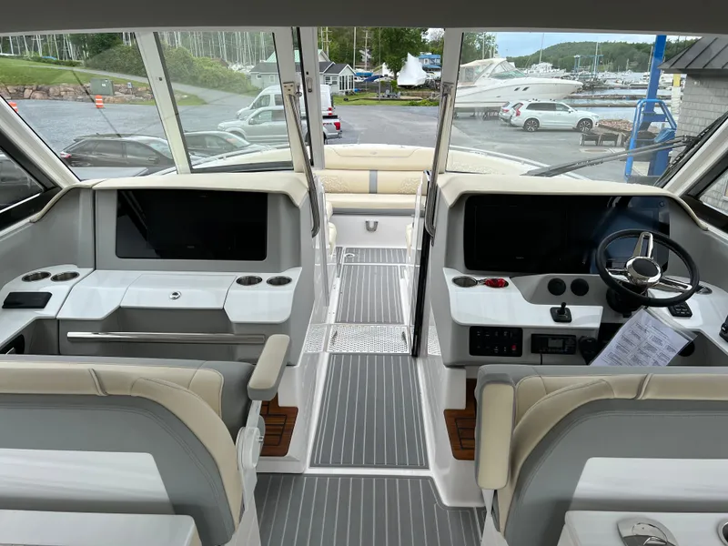 Slide: The Image of 2022 Regal LS36 boat interior with modern dashboard and seating. - 38