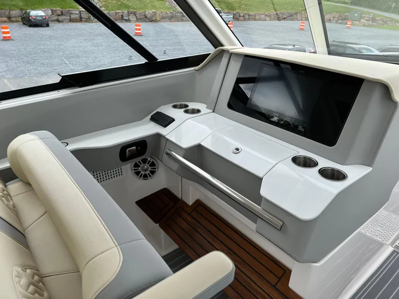Slide: The Image of 2022 Regal LS36 boat interior with modern dashboard and seating. - 45