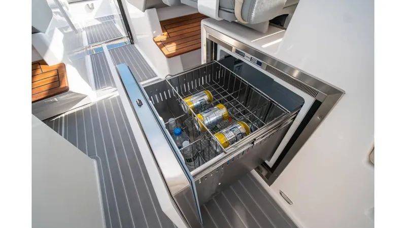 Slide: The Image of Regal LS36 2022 boat interior with open fridge and drinks inside. - 9