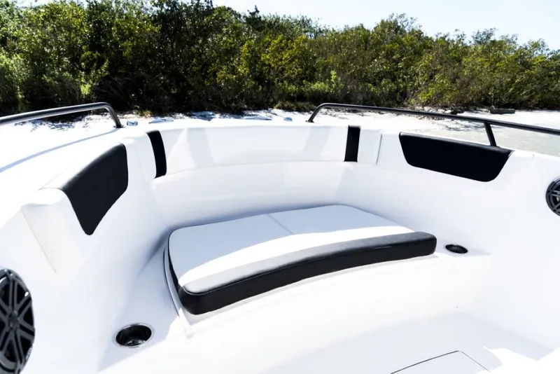 Slide: The Image of 2025 Edgewater 208CC Watchman boat interior with cushioned seating and sleek design. - 11