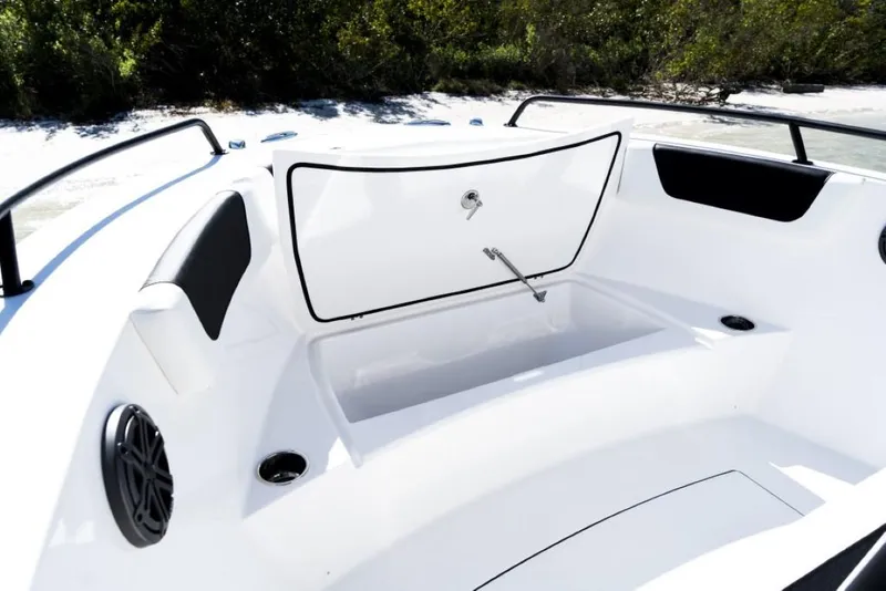 Slide: The Image of Edgewater 208CC Watchman 2025 boat interior with open storage compartment. - 12