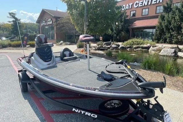 Slide: The Image of 2025 Nitro Z17 boat on trailer outside boat center. - 2
