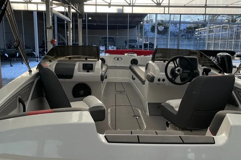 Slide: The Image of 2025 Tahoe T21 boat interior with dual seating and modern dashboard. - 3
