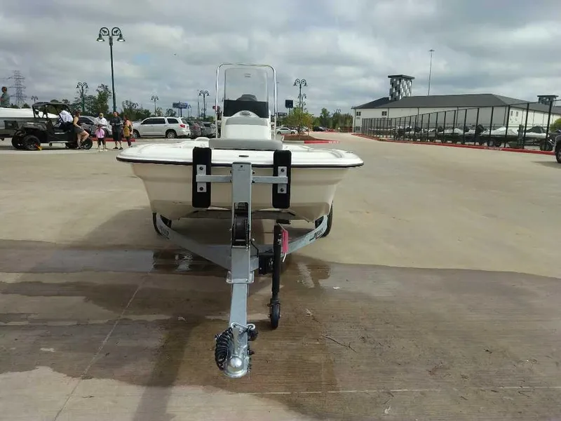 Slide: The Image of 2025 Mako Pro Skiff 13 CC on trailer in parking lot. - 2