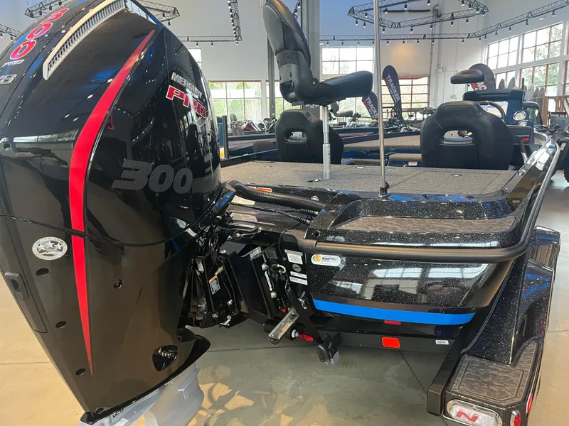 Slide: The Image of 2025 Nitro Z21 XL boat with powerful 300 horsepower engine in showroom. - 2