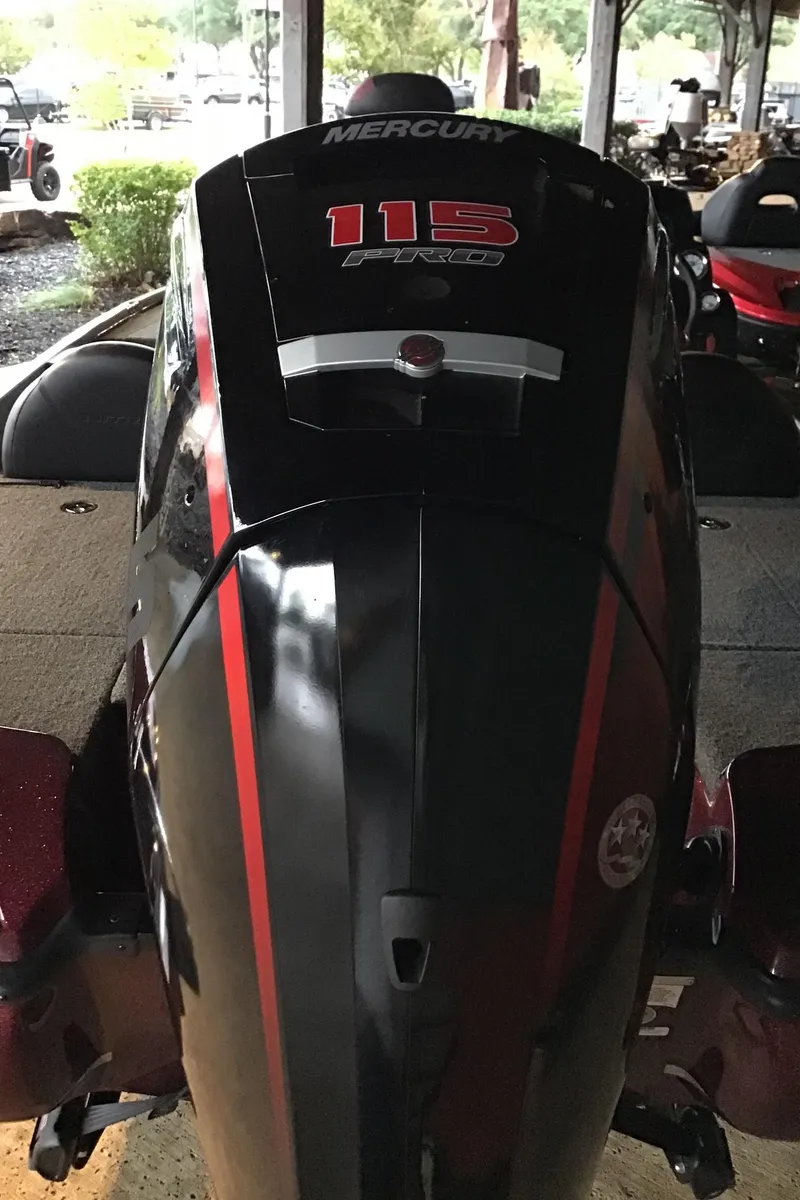 Slide: The Image of 2025 Nitro Z17 boat with Mercury 115 ProXS engine, black and red design. - 4