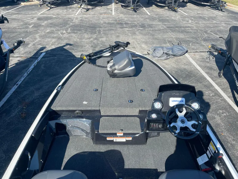 Slide: The Image of 2025 Nitro Z17 fishing boat interior with steering wheel and control panel. - 3