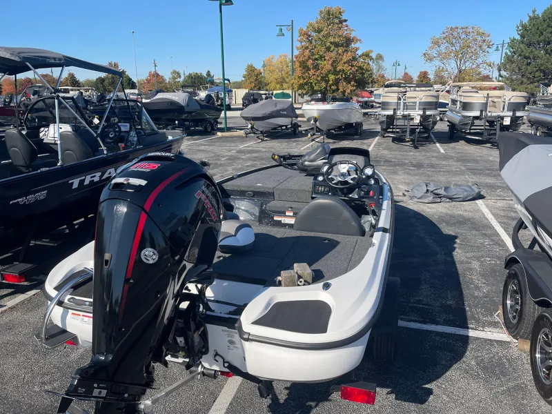 Slide: The Image of 2025 Nitro Z17 boat in a parking lot with other boats. - 4