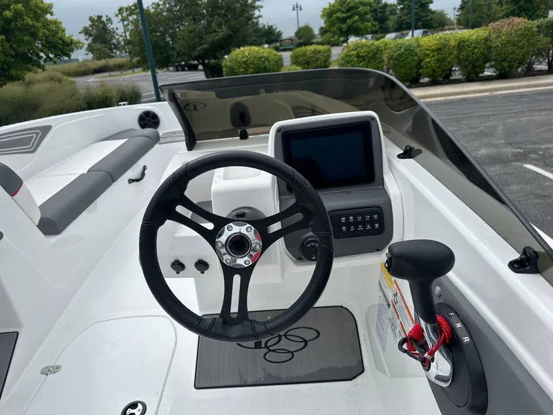 Slide: The Image of 2025 Tahoe T21 boat cockpit with steering wheel and control panel. - 5