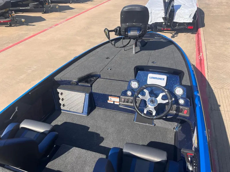 Slide: The Image of 2025 Nitro Z18 boat interior with steering wheel and navigation system. - 1