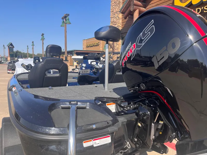 Slide: The Image of 2025 Nitro Z18 boat with powerful engine, parked outdoors under clear blue sky. - 3