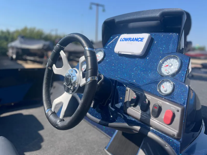 Slide: The Image of Nitro Z18 2025 boat dashboard with steering wheel and Lowrance display. - 4