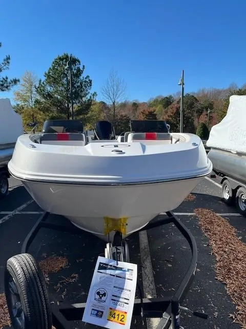 Slide: The Image of 2025 Tahoe T21 boat on trailer in outdoor setting. - 3