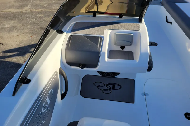 Slide: The Image of 2025 Tahoe T21 boat interior with seating and storage compartments, featuring sleek design elements. - 73