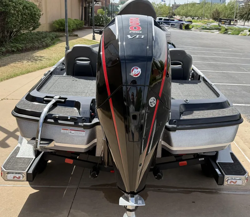 Slide: The Image of 2025 Nitro Z21 XL boat with powerful V8 engine, parked outdoors. - 11