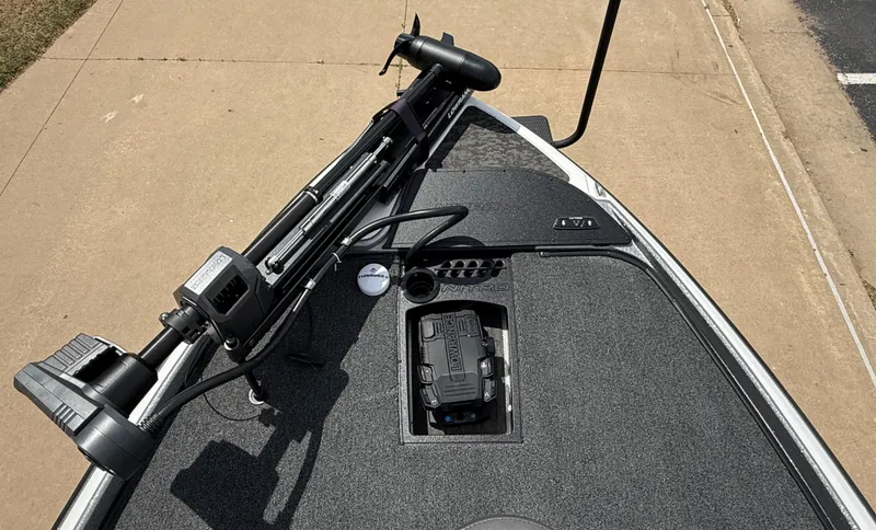 Slide: The Image of 2025 Nitro Z21 XL boat deck with trolling motor and storage compartment. - 9