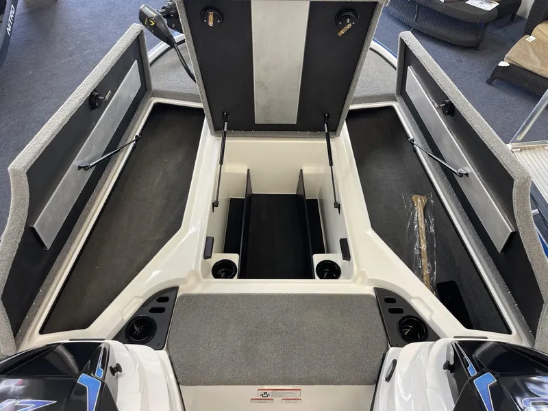 Slide: The Image of 2025 Nitro Z18 boat interior with open storage compartments and seating area. - 10