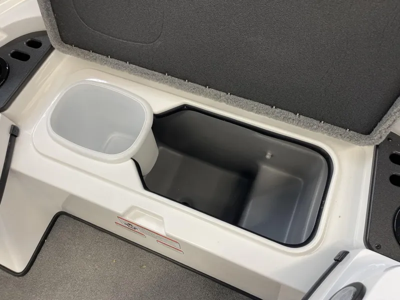 Slide: The Image of 2025 Nitro Z18 boat storage compartment with cup holder, featuring sleek design and functionality. - 11