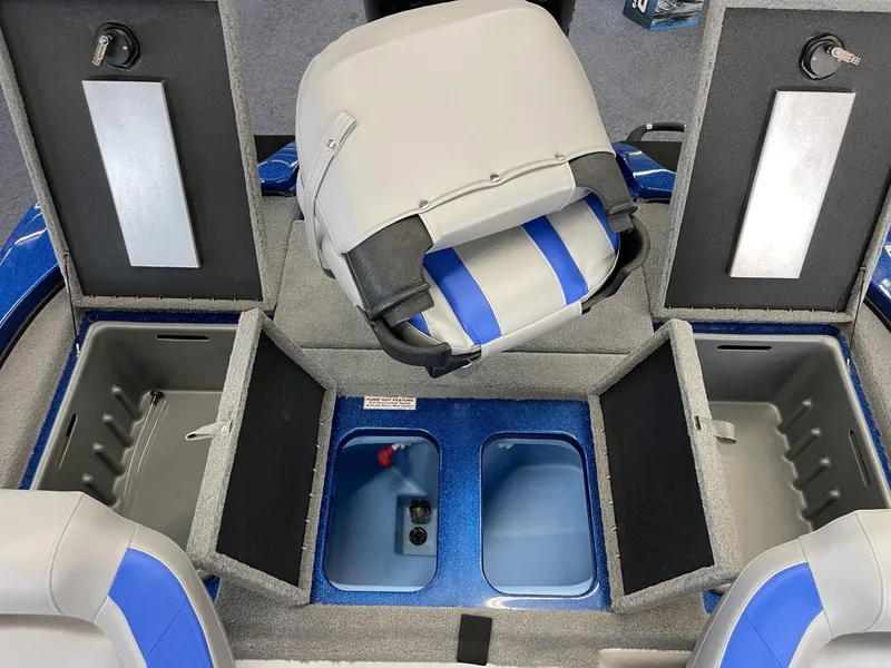 Slide: The Image of 2025 Nitro Z18 boat interior with storage compartments and blue-gray seating. - 13