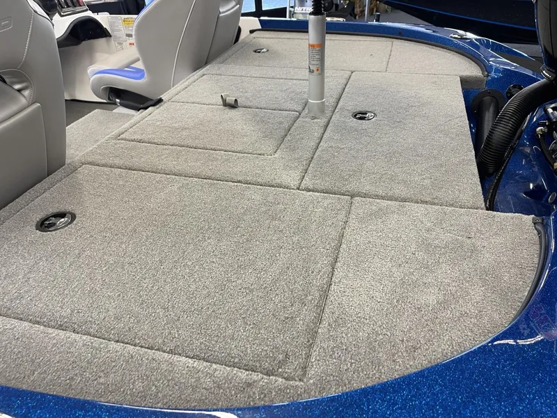 Slide: The Image of 2025 Nitro Z18 boat interior with gray carpeted deck and seating. - 4