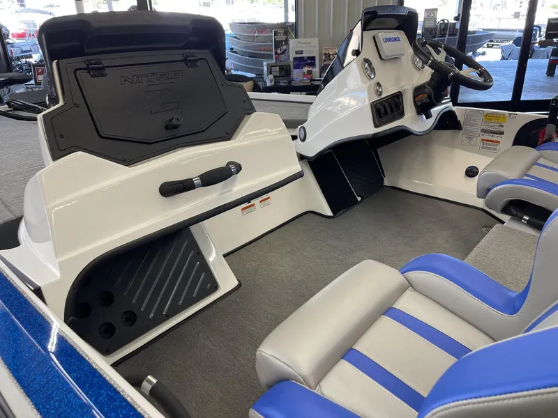 Slide: The Image of Interior of 2025 Nitro Z18 boat with blue and gray seating. - 5