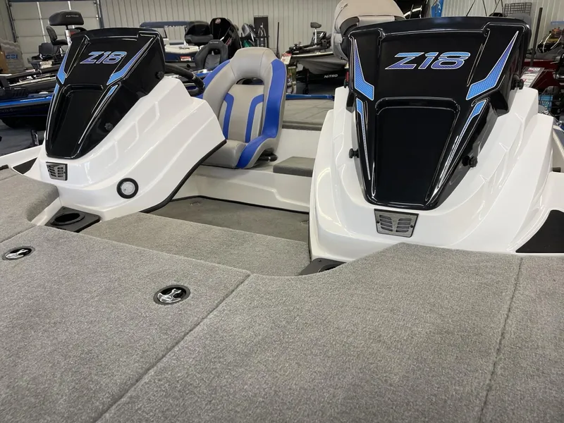 Slide: The Image of 2025 Nitro Z18 boat interior with dual consoles and seating. - 8
