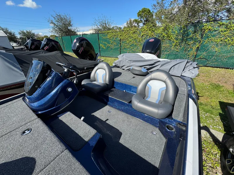 Slide: The Image of 2025 Nitro Z17 boat with dual seats and covered outboard motors. - 2