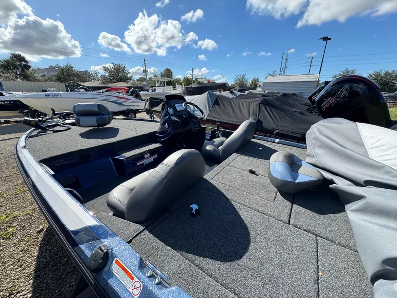 Slide: The Image of 2025 Nitro Z17 boat with gray interior, parked outdoors under a blue sky. - 3