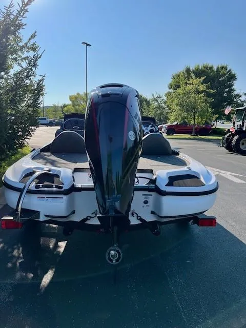 Slide: The Image of 2025 Nitro Z17 boat with powerful outboard motor in a sunny parking lot. - 5