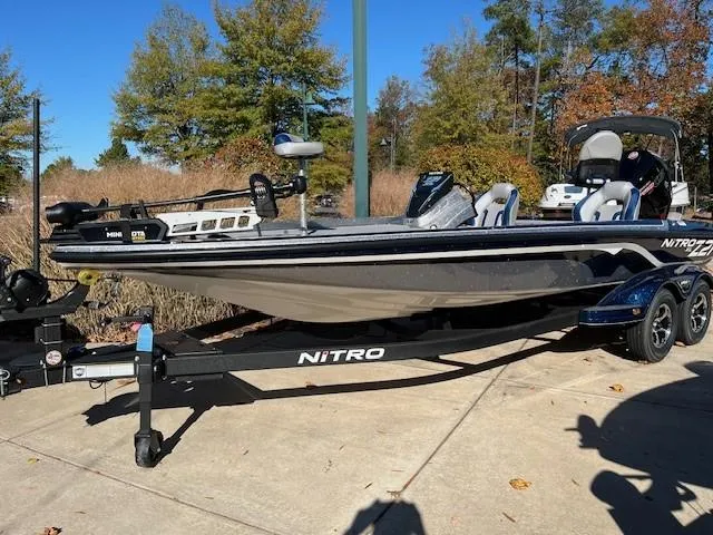 The Image of 2025 Nitro Z21 XL boat on trailer, parked outdoors. - 0