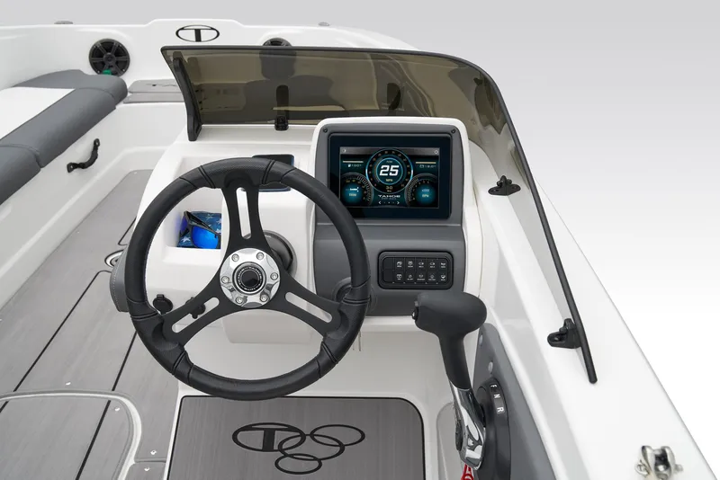 Slide: The Image of 2025 Tahoe T21 boat dashboard with steering wheel and digital display. - 36