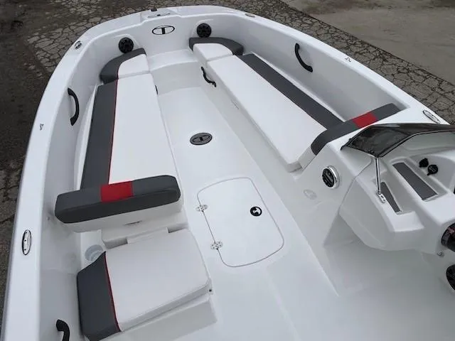 Slide: The Image of 2025 Tahoe T18 boat interior with sleek white and gray seating design. - 5