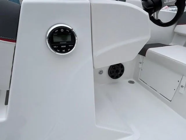 Slide: The Image of 2025 Tahoe T18 boat interior with control panel and seating area. - 7