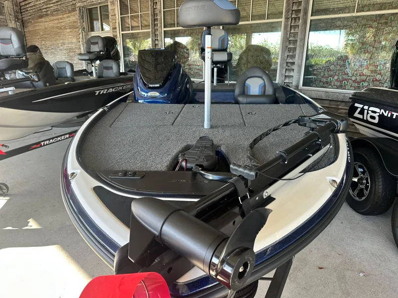Slide: The Image of 2025 Nitro Z17 fishing boat with trolling motor in showroom. - 2